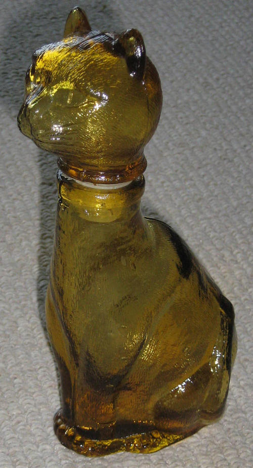 BROWN GLASS BOTTLE IN THE SHAPE OF A CAT. 18cm high - approx 9cm wide